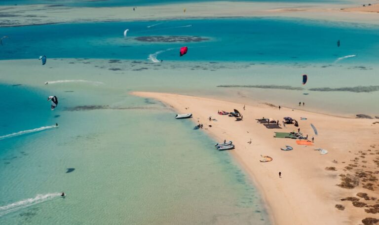 Kitesurfers riding in turquoise lagoons during one-day safari in El Gouna