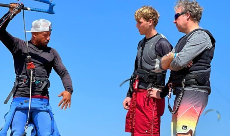 Instructor showing student how to rig the kite during a kitesurfing lesson in El Gouna.