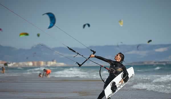 Kitesurfer riding the waves at Geisum Island in the Red Sea, Egypt