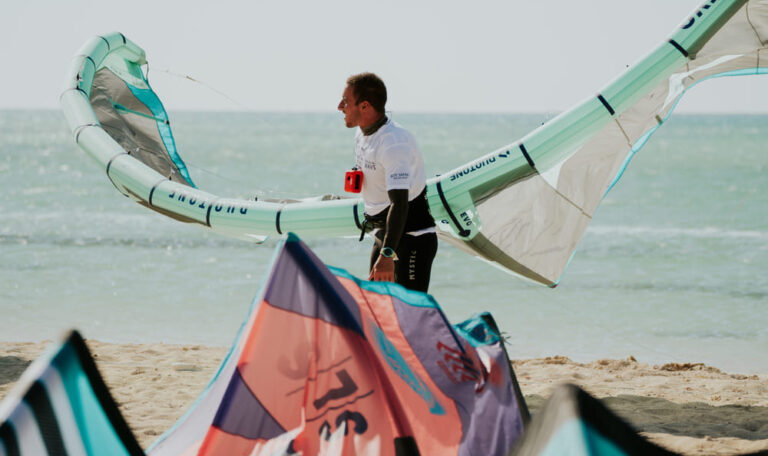 Kitesurfer setting up kite on the beach in El Gouna, Egypt