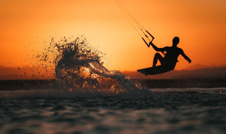 Kitesurfer riding at sunset during a kiteboarding camp in Egypt