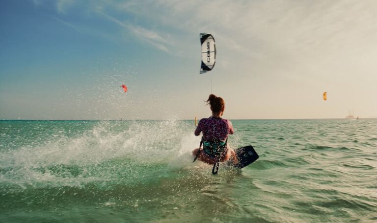 Kitesurfer riding the Red Sea waves during one-week kite safari in Egypt